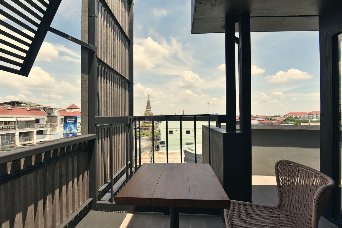 KWANS Suite balcony with a temple chedi view