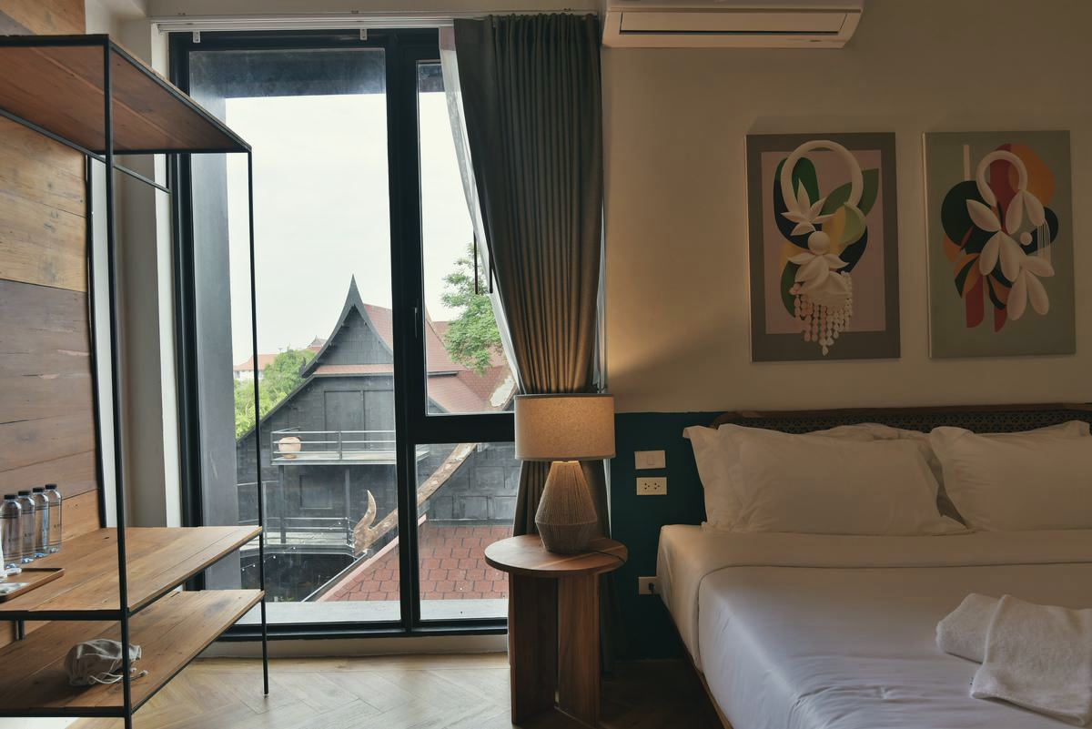 Holy Superior room opening to a balcony over traditional roofs